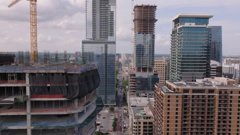 Aerial view of urban development in Austin, Texas. Construction cranes and Stock Footage 276981318