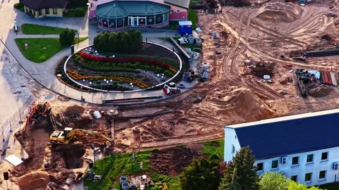 Aerial view of urban development with construction equipment and workers Stock Footage 346596818