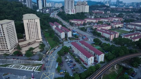 Aerial View of Urban Development with Modern Buildings and Roads Stock Footage 312144022