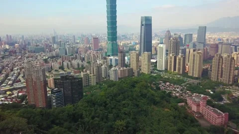 Aerial View of Urban Forest Surrounded by Taipei High Rise Buildings 4K Stock Footage 346049765