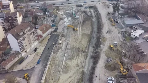 Aerial view of urban infrastructure construction site with heavy machinery Stock Footage 346410508