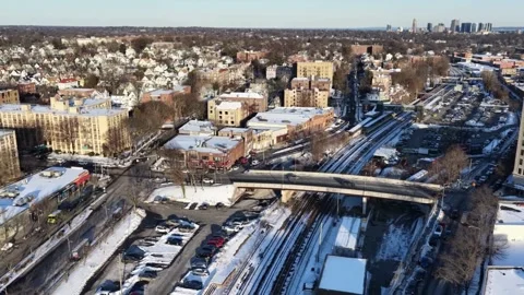 Aerial view of urban intersection and railway tracks in winter snowfall. Stock-Footage 344242273