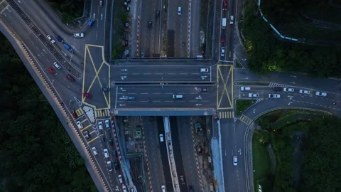 Aerial View of Urban Intersection with Busy Traffic Flow at Night Stock Footage 312143687