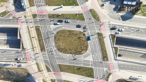 Aerial view of urban intersection with multiple roads, crosswalks and vehicles Stock-Footage 332280979