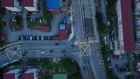 Aerial View of Urban Intersection with Traffic and Buildings Surrounding Stock Footage 312143924