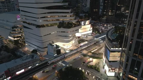 Aerial View of Urban Train Arriving at Night Station in Bangkok, Thailand Stock Footage 333598677
