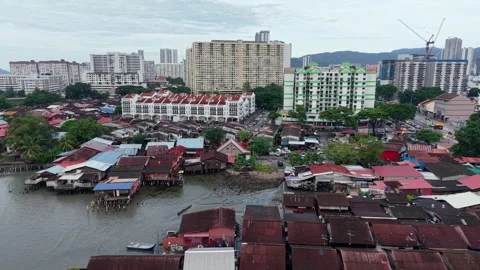 Aerial view of urban waterfront houses with modern cityscape background Stock Footage 336948053