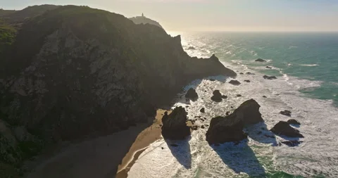Aerial view Ursa beach Atlantic coastal surf with foamy waves crashing over big Video stock 311803626