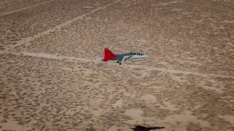 Aerial view of U.S. Air Force T-7A Red Hawk flying and arriving at Edwards AFB Stock Footage 255372906