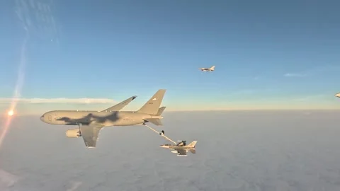 Aerial view U.S. Air Force KC-135 Stratotanker aerial refueling F-16 Aggressor Stock Footage 281154936