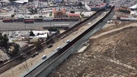 Aerial view of the U.S.-Mexico border wall in California Stock Footage 300854558