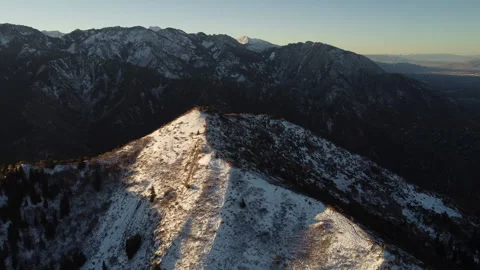 Aerial view of Utah mountain in the fall with snow on the peak at sunrise Stock Footage 276415077