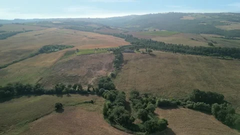 Aerial view of the Val D'Orcia during a beautiful sunrise. 4k Stock Footage 269774728