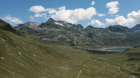 Aerial view of Val Loga - Approaching Montespluga Lake Town and Pizzo Suretta Vidéo 253497653