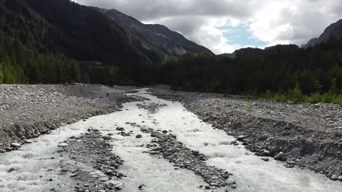Aerial view - Val Veny, flying over an alpine stream in a valley Stock Footage 137394462