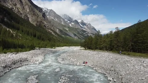 Aerial view - Val Veny, flying over an alpine stream in a valley Stock Footage 137394641