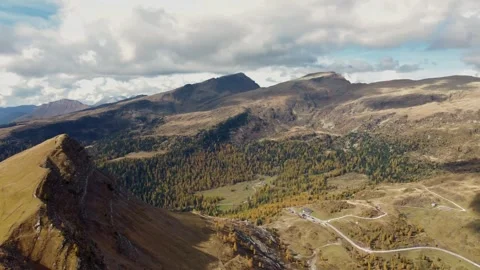 Aerial view of the Valles Pass with Cima Valles and the mountain road Stock Footage 295890542