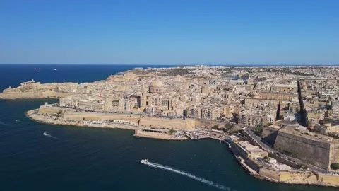 Aerial view of Valletta's stone architecture and dome overlooking the harbour Stock Footage 337003345