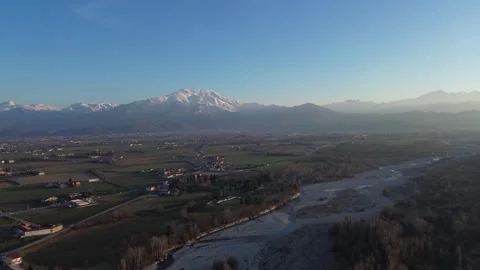 Aerial view of a valley with mountains in the background Stock Footage 328615568