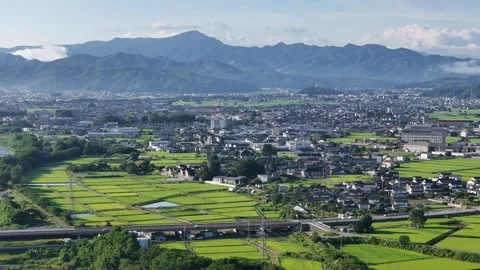 Aerial view of a valley with rice fields and mountains Stock Footage 340890941