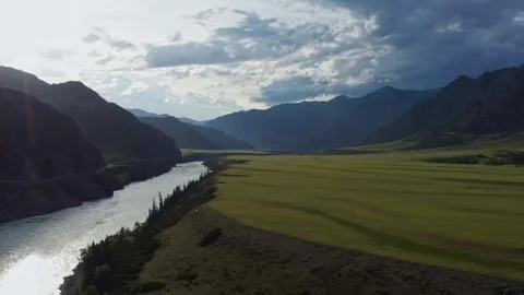 Aerial view of the valley with the river between the mountains Stock Footage 317714358