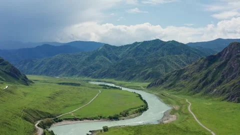 Aerial view of the valley with the river between the mountains Stock Footage 317716102