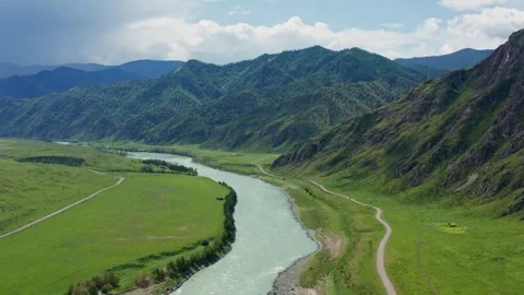 Aerial view of the valley with the river between the mountains Stock Footage 317767148