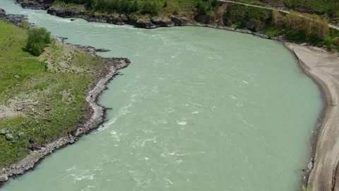 Aerial view of the valley with the river between the mountains Stock Footage 317767177