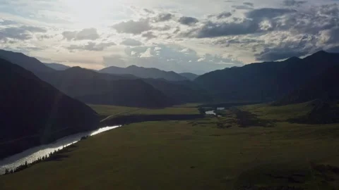 Aerial view of the valley with the river between the mountains Stock Footage 317767403