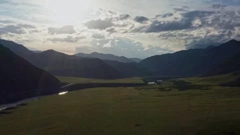 Aerial view of the valley with the river between the mountains Stock Footage 317767433
