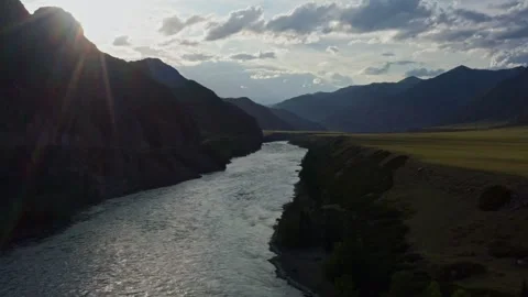 Aerial view of the valley with the river between the mountains Stock Footage 317767484