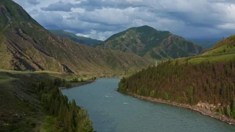 Aerial view of the valley with the river between the mountains Stock Footage 317767496