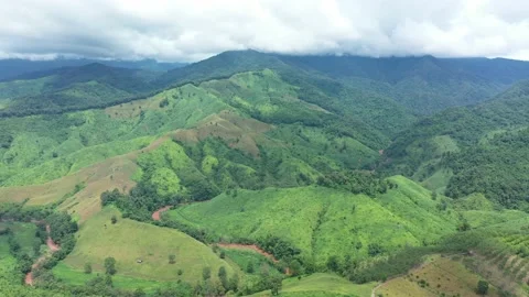 Aerial view of valley surrounded by mountains  Stock Footage 155241532