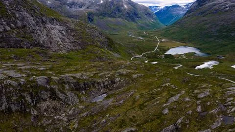 Aerial view of valley with winding road and glacial lakes, Rauma region Norwa Foto stock