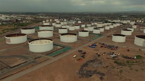 Aerial View of Vast Fuel Storage Tank Farm with Circular Tanks Stock Footage 334950722