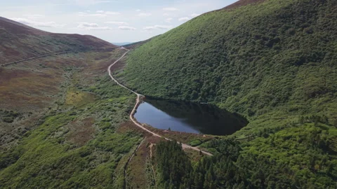 Aerial View Of Vee Pass Lake And Winding Road In Ireland Video stock 345007964