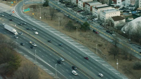 Aerial view of vehicles driving on a highway in New York. Wide shot. 4k shot wit Stock Footage 199455953