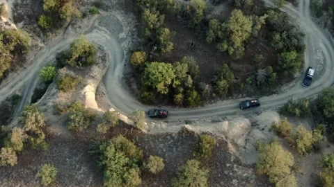 Aerial view, vehicles going up the hill with surreal landscape in Vashlovani 库存影片 238478041