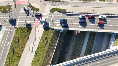 Aerial view of vehicles navigating a busy intersection with multiple lanes Stock-Footage 331382765