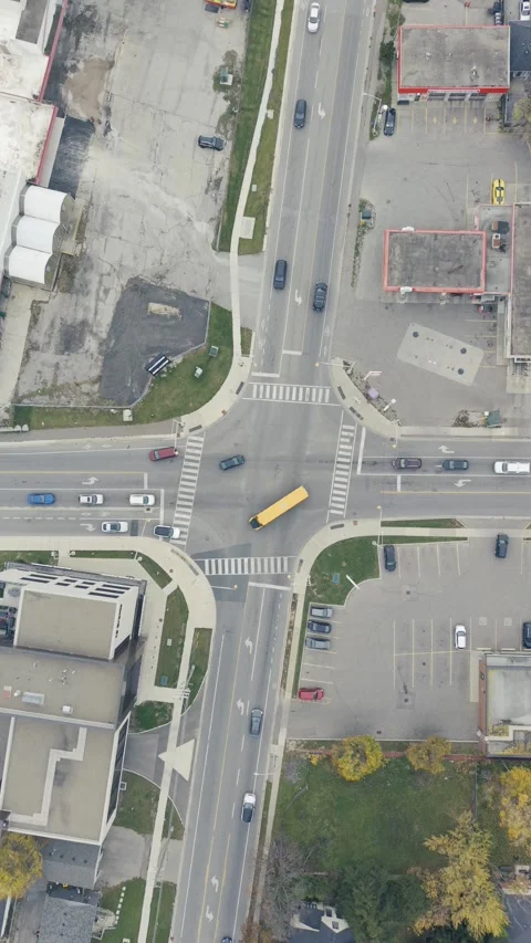 Aerial View of vehicles passing through road intersection in Ontario Canada Stock Footage 320417088