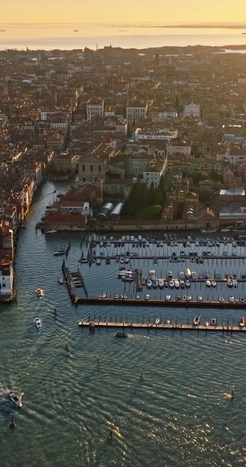 Aerial view of venice with boats navigating canal at sunset, historic build.. Video stock 339203237