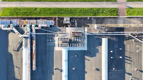 Aerial view of ventilation system on factory rooftop. Multiple cooling units Stock Footage 336611504