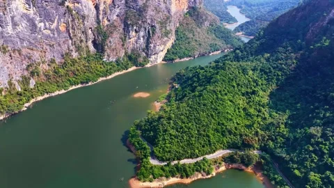 Aerial View of Verdant Cliffs and Meandering River with Road China Stock Footage 346333177