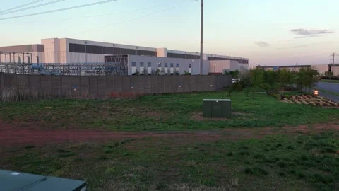Aerial view of Verizon data center in Ashburn, Virginia at sunset showing power Stock Footage 333701248