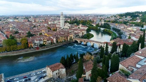 Aerial view of verona city center flying forwards at dawn Stock Footage