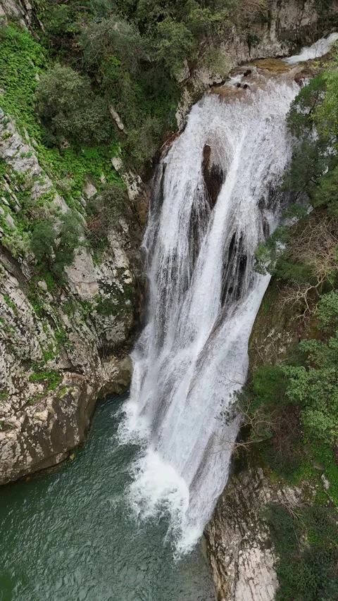 Aerial view vertical of Polylimnio Waterfall in Messinia, Greece after heavy rai 스톡 동영상 303188769