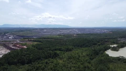 Aerial view of a very large coal mining area, and many holes can be seen du.. Stock Footage 328711103