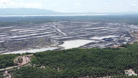 Aerial view of a very large coal mining area, and many holes can be seen du.. Stock Footage 328970461