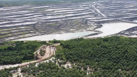 Aerial view of a very large coal mining area, and many holes can be seen du.. Stock Footage 329401334