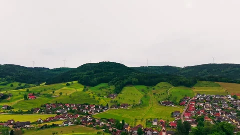 Aerial View of Vibrant Green Rolling Hills and Lush Forests in the Countryside 動画素材 338350378